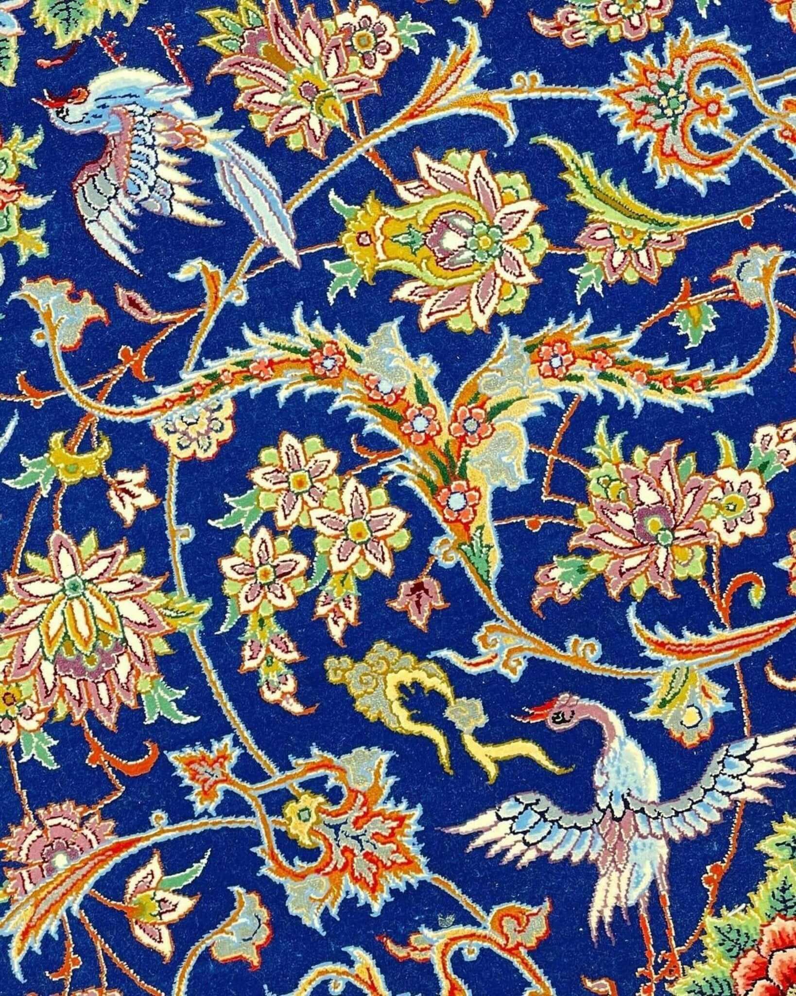 "Handmade blue Persian rug, perfect for home decor, featuring a mix of silk and wool for softness."